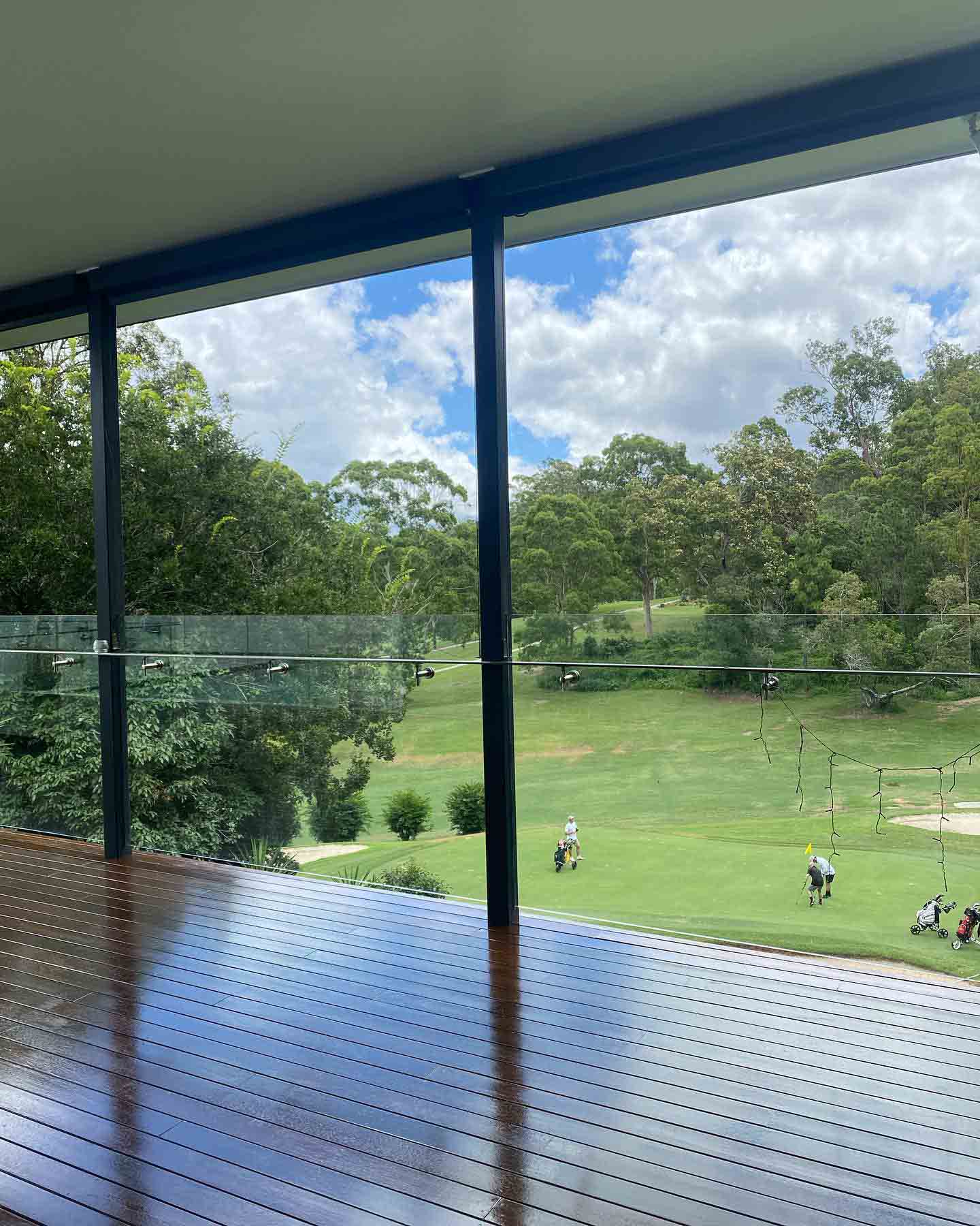 Glossy covered timber deck overlooking a golf course
