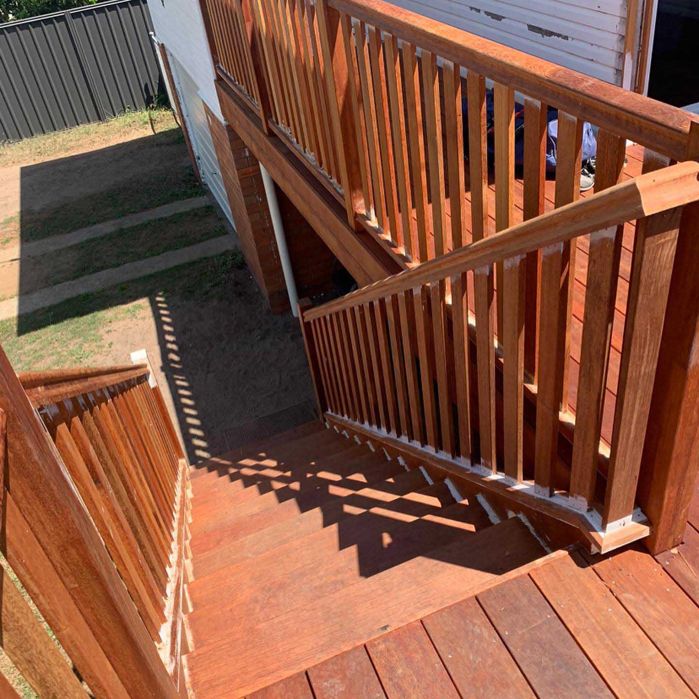 Freshly oiled timber stairs and landing with timber balustrade