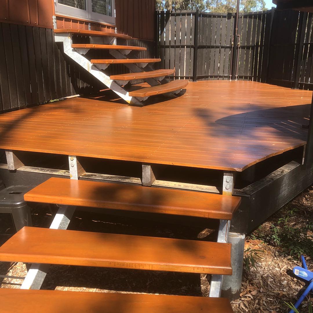 Freshly oiled timber deck with open timber steps and stairs